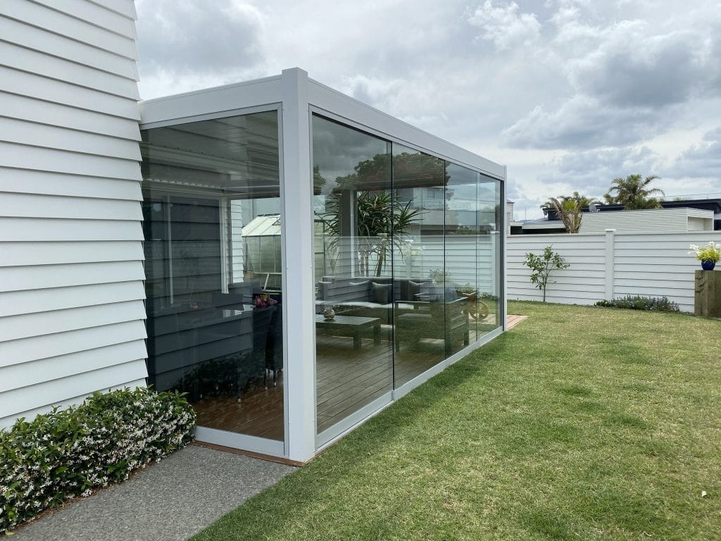 Glaslide sliding glass walls enclosing an outdoor room